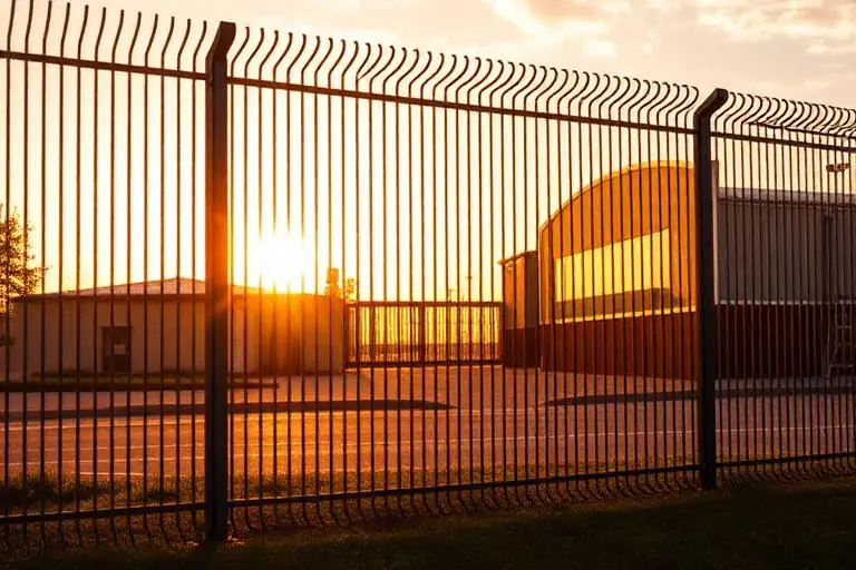 Palisade fence at golden hour